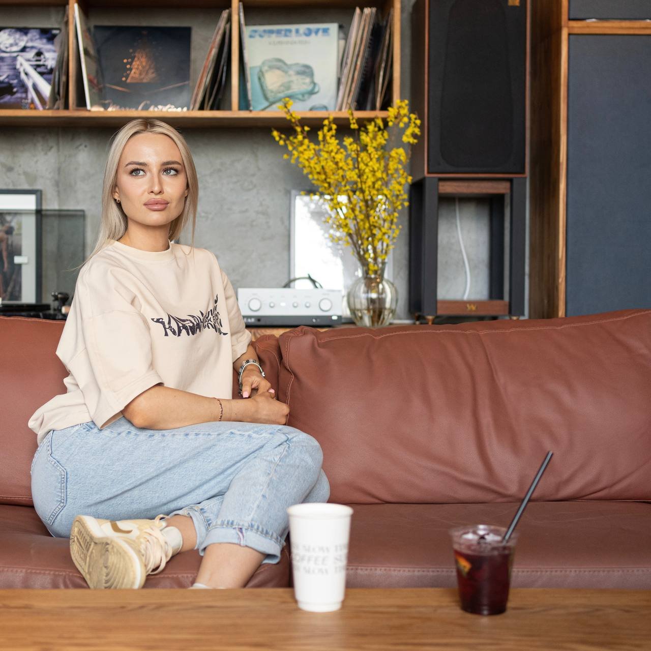 Ak Bars drop 1 — model in a cream oversized tee with the hand-lettered club graphic