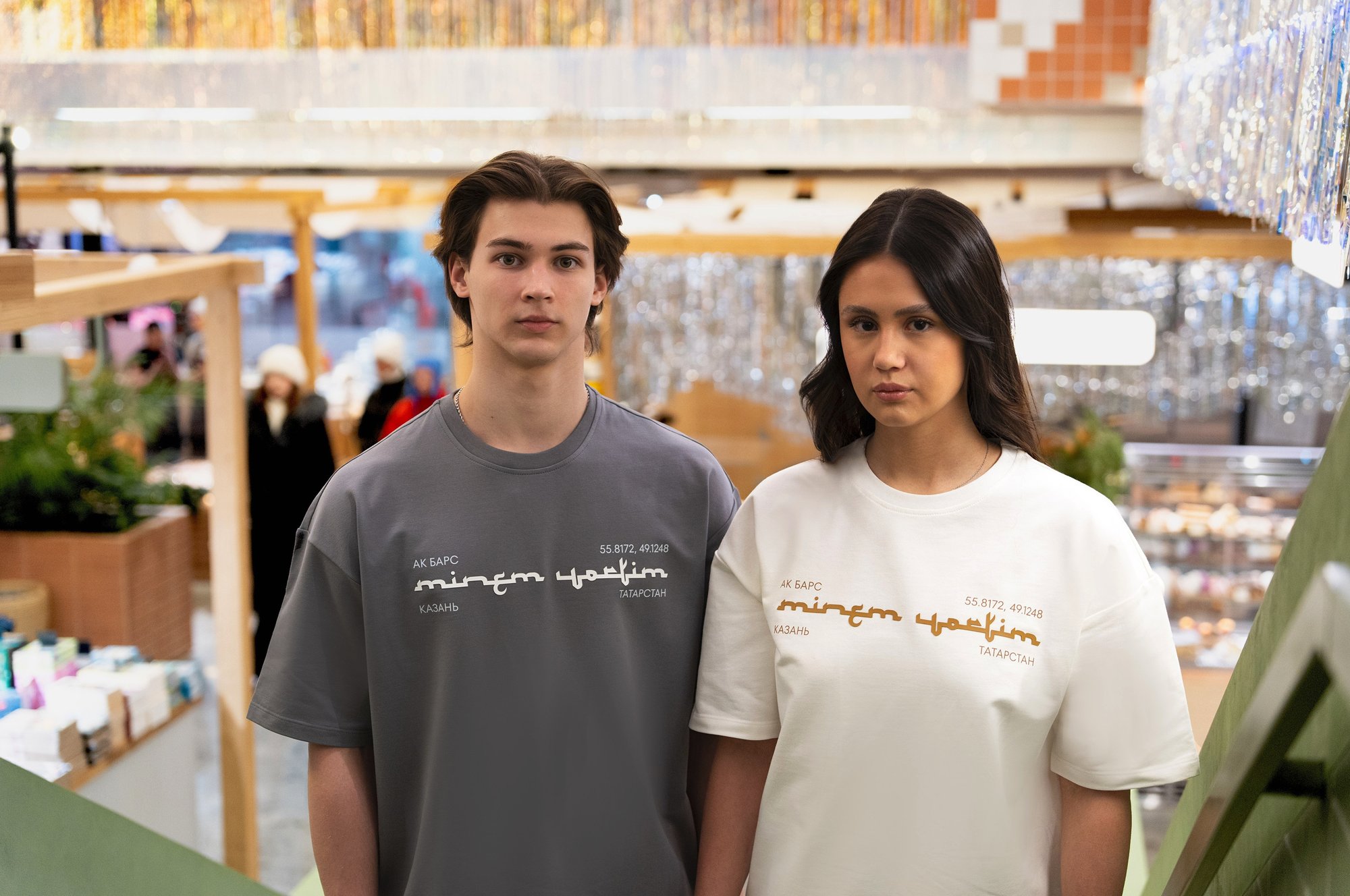 Ak Bars drop 3 — two models wearing grey and cream club tees