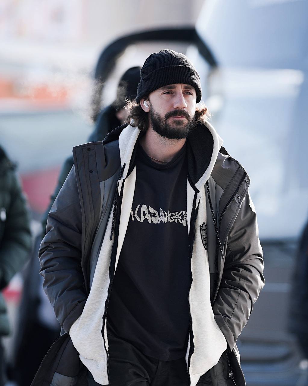 Ak Bars drop 1 — model looking down in a dark club tee