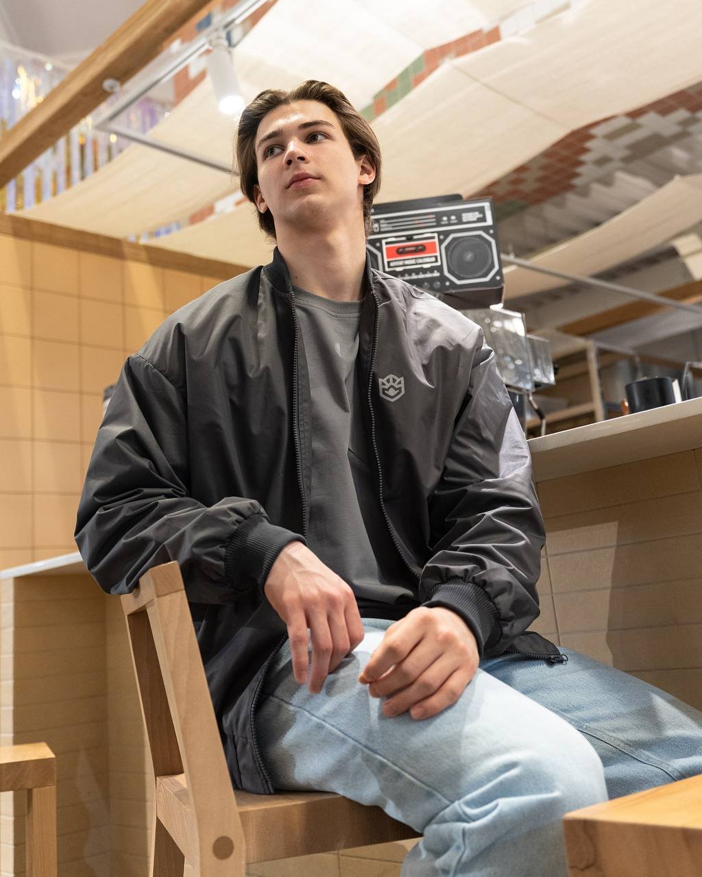 Ak Bars drop 3 — model in the mall in a club tee