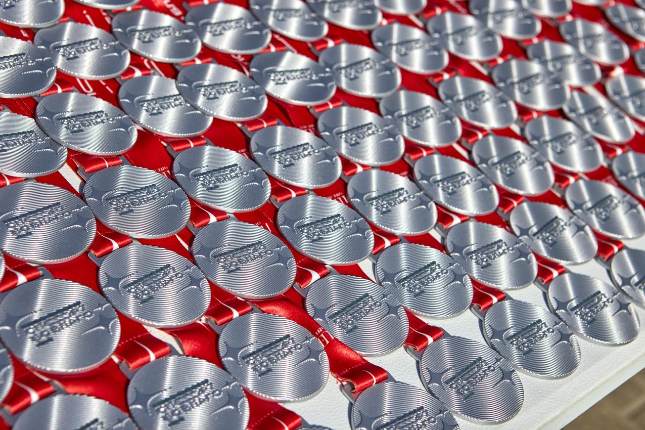 Close-up of stacked finisher medals